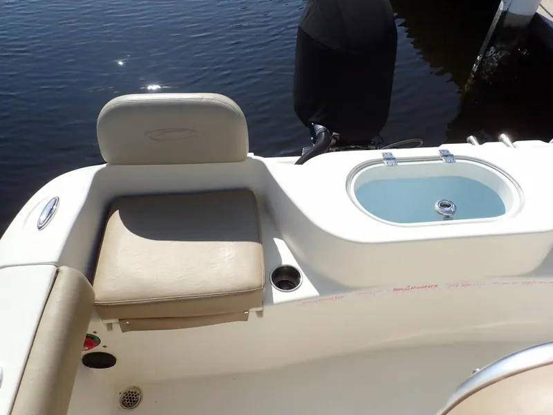 Slide: The Image of 2016 Cobia 217 Center Console boat with seating and livewell. - 31