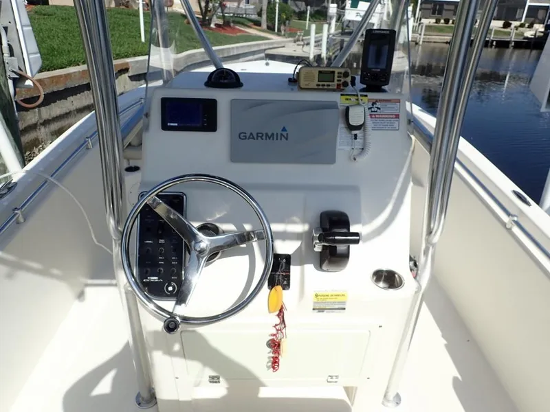 Slide: The Image of 2016 Cobia 217 Center Console boat dashboard with Garmin navigation system. - 6