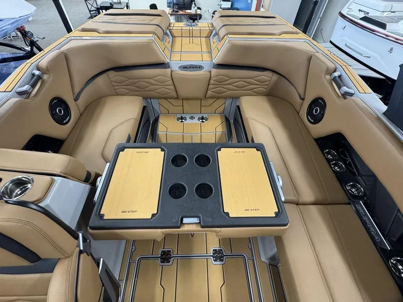 Slide: The Image of Luxurious interior of 2025 Supra SV 400 boat with tan seating and table. - 11