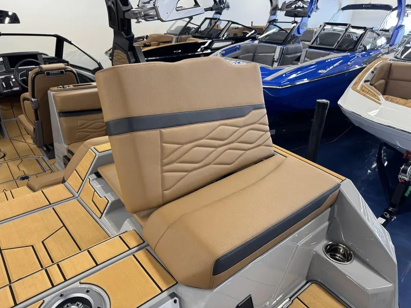 Slide: The Image of 2025 Supra SV 400 boat interior with tan leather seats and modern design. - 21