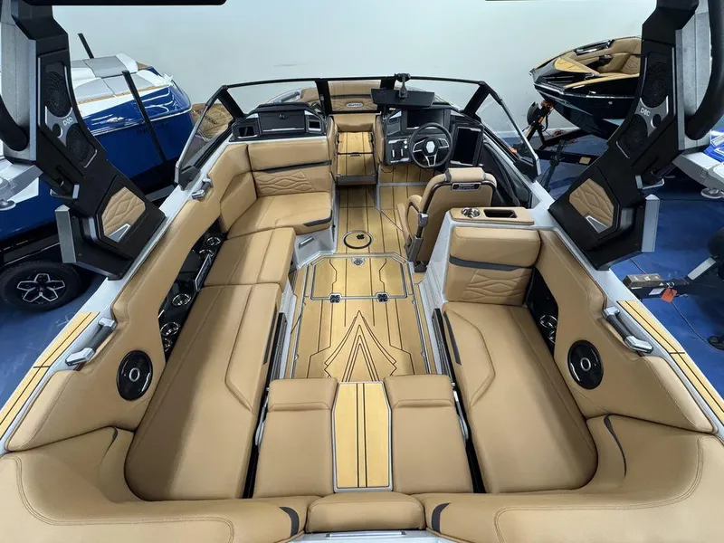 Slide: The Image of Luxurious interior of 2025 Supra SV 400 boat with tan leather seating and modern dashboard. - 8