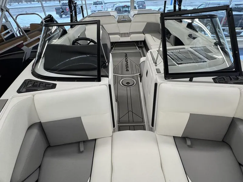 Slide: The Image of 2025 Moomba Craz boat interior with modern seating and sleek design. - 15
