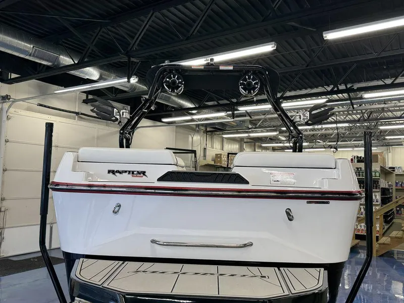 Slide: The Image of 2025 Moomba Craz boat in showroom, featuring Raptor engine and sleek design. - 3