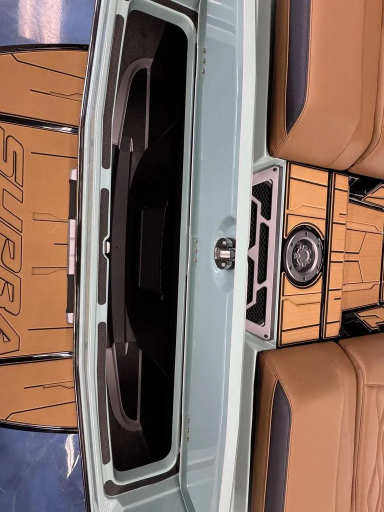 Slide: The Image of 2025 Supra SL 450 interior with tan seats and stylish wood paneling. - 10