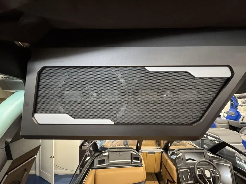 Slide: The Image of 2025 Supra SL 450 interior with advanced speaker system and modern dashboard design. - 13