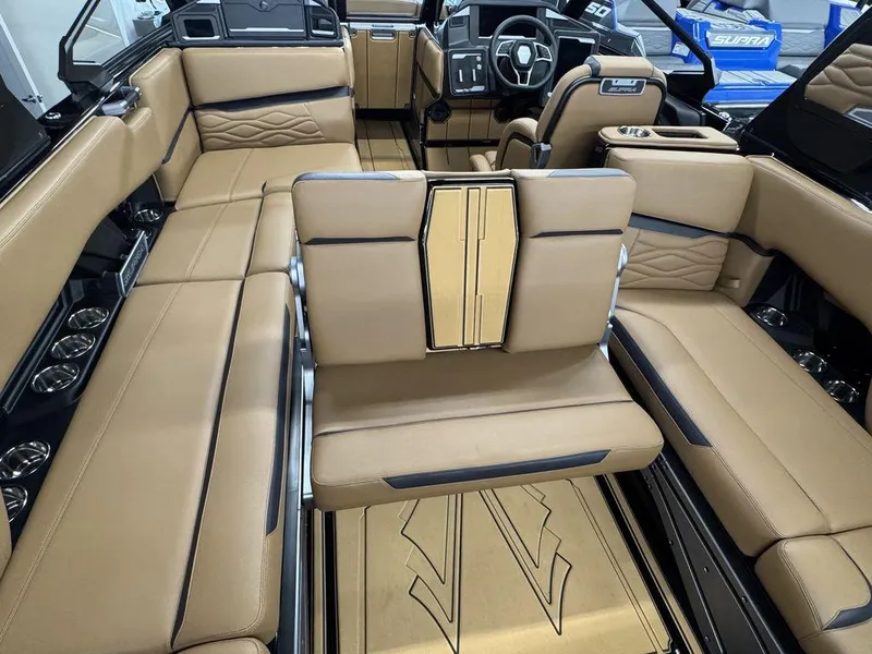 Slide: The Image of Luxurious interior of 2025 Supra SL 450 boat with tan leather seating and modern dashboard. - 16