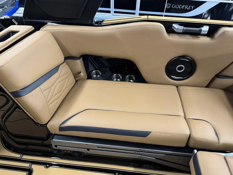Slide: The Image of 2025 Supra SL 450 interior with tan leather seating and built-in speaker system. - 22