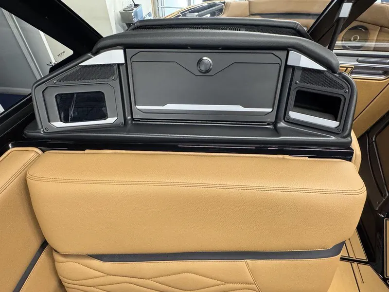 Slide: The Image of 2025 Supra SL 450 interior with tan leather seats and modern speaker system. - 24