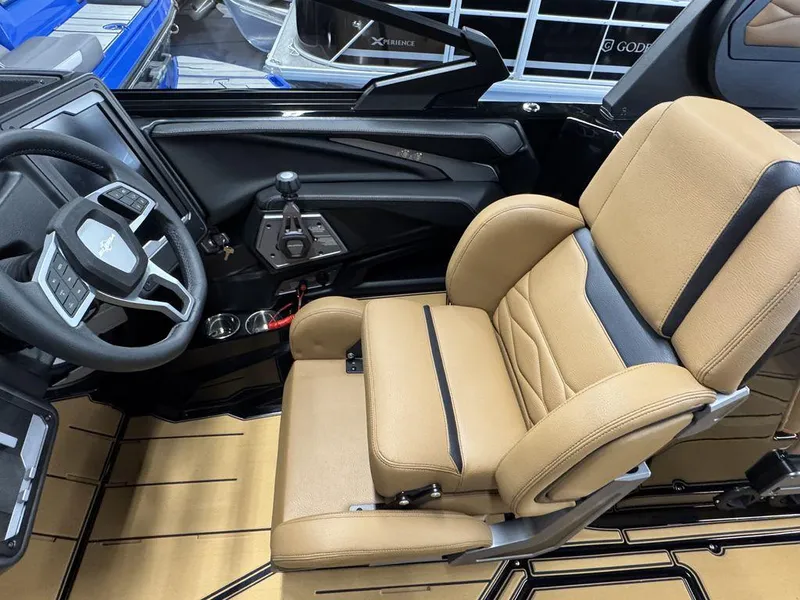 Slide: The Image of 2025 Supra SL 450 interior with tan leather seat and modern steering wheel design. - 25