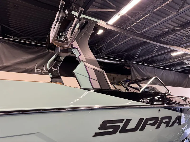 Slide: The Image of 2025 Supra SL 450 boat in showroom, showcasing sleek design and advanced features. - 28
