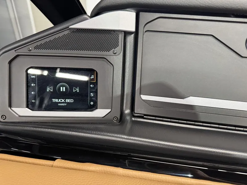 Slide: The Image of 2025 Supra SL 450 dashboard with music player displaying "Truck Bed" by Hardy. - 32