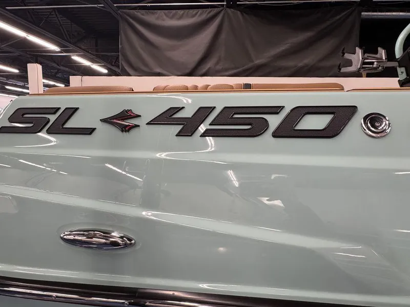 Slide: The Image of 2025 Supra SL 450 boat logo on sleek light blue surface. - 7