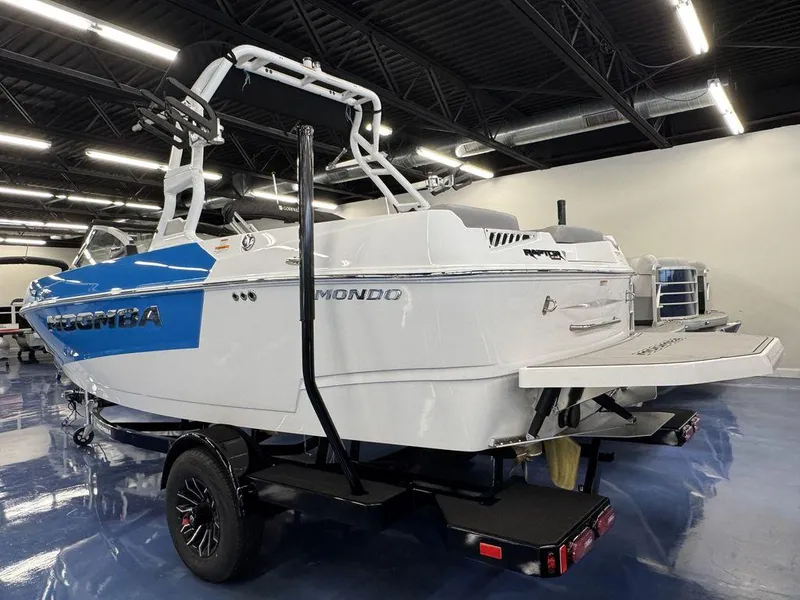 Slide: The Image of 2025 Moomba Mondo boat in showroom, featuring sleek design and modern features. - 10