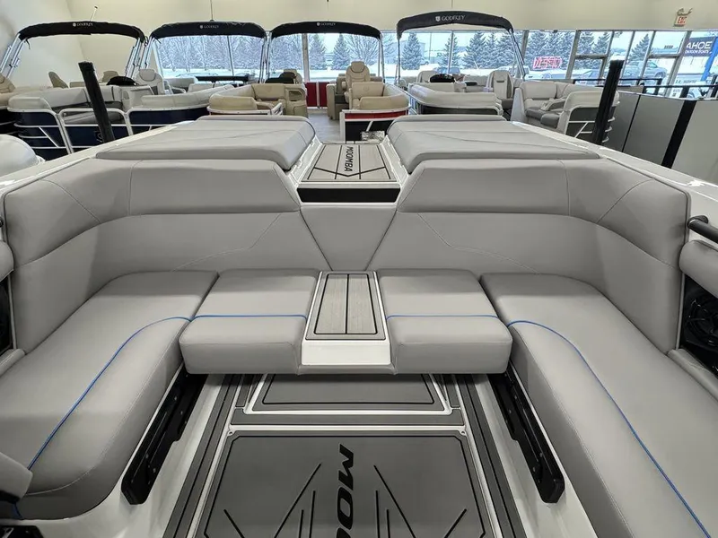 Slide: The Image of 2025 Moomba Mondo boat interior with gray seating and sleek design. - 12