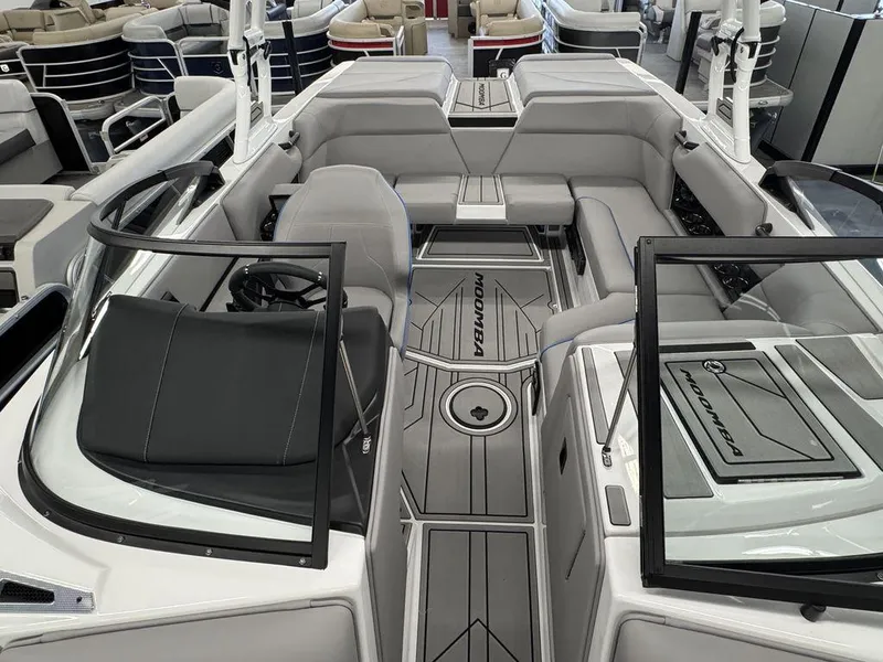 Slide: The Image of 2025 Moomba Mondo boat interior with gray seating and sleek design. - 18