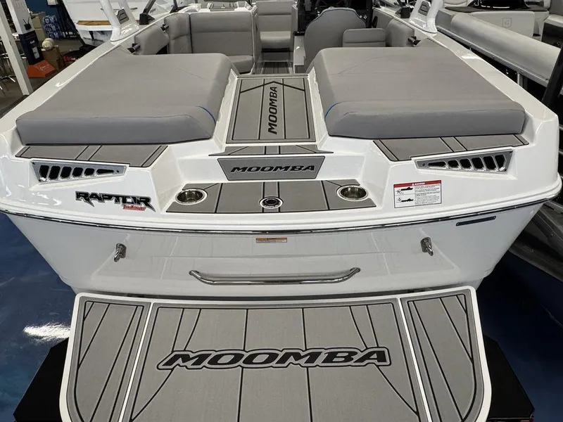 Slide: The Image of 2025 Moomba Mondo boat with Raptor engine, featuring spacious seating and sleek design. - 2