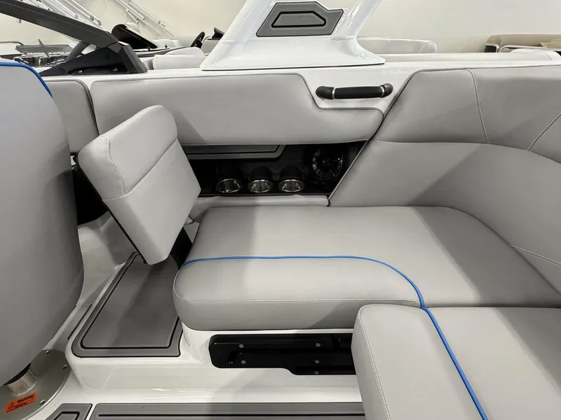 Slide: The Image of 2025 Moomba Mondo boat interior with gray seating and cup holders. - 4