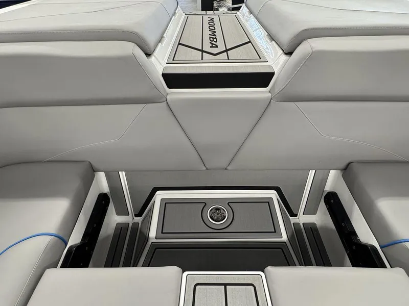 Slide: The Image of 2025 Moomba Mondo boat interior with sleek gray seating and modern design. - 6