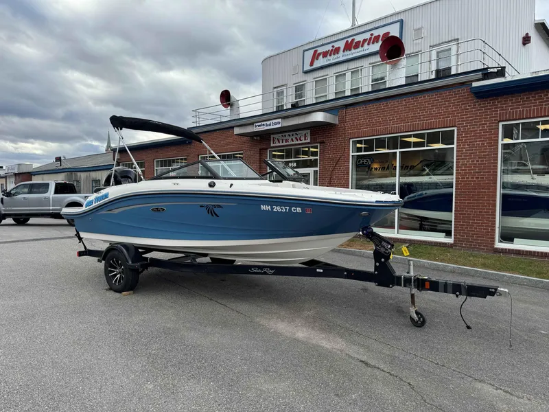 Slide: The Image of 2023 Sea Ray 190SPXO boat on trailer outside Irwin Marine dealership. - 1