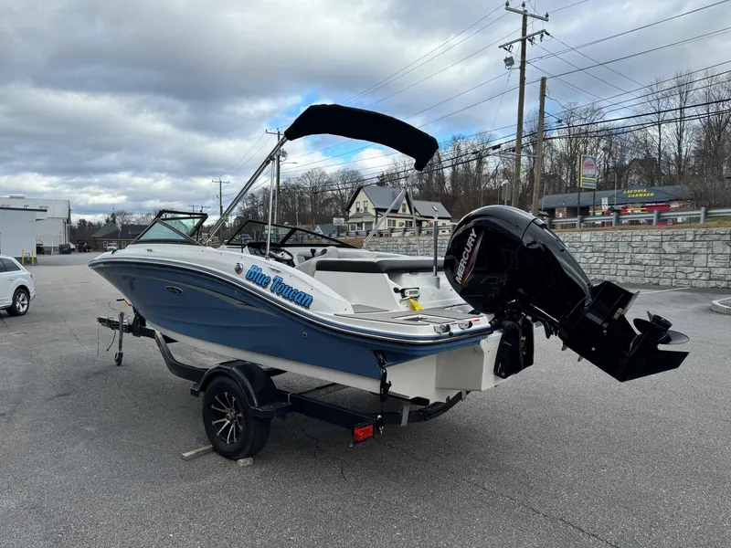 Slide: The Image of 2023 Sea Ray 190SPXO boat with Mercury outboard motor on a trailer. - 3