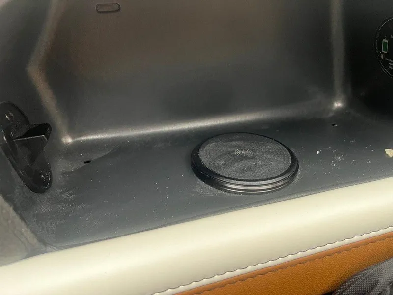 Slide: The Image of Interior of 2025 Malibu 23 MXZ with wireless charging pad. - 13