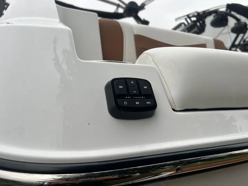 Slide: The Image of 2025 Malibu 23 MXZ boat interior with audio control panel. - 20