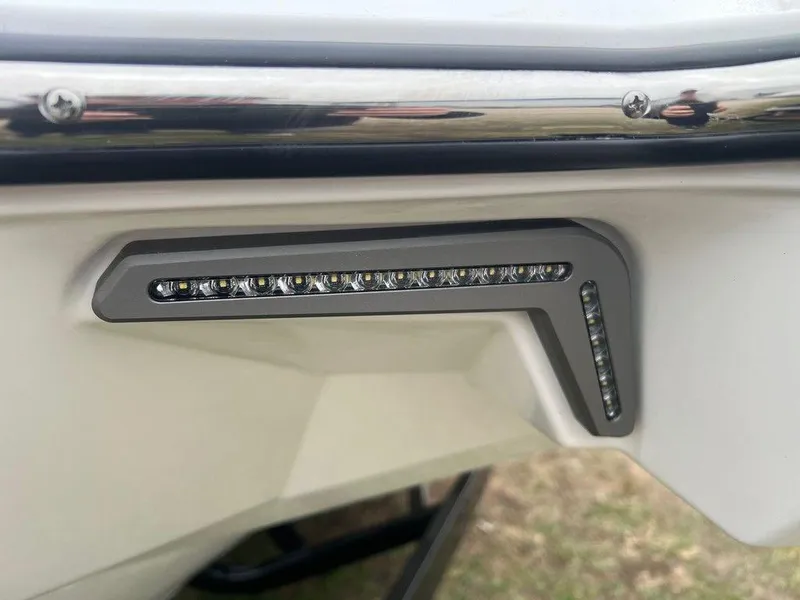 Slide: The Image of 2025 Malibu 23 MXZ boat detail with sleek LED lighting. - 24