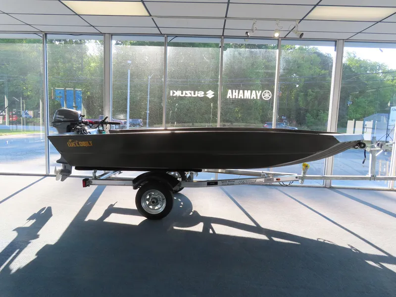 Slide: The Image of 2025 WeldBilt 1448V boat on trailer in showroom with large windows. - 0