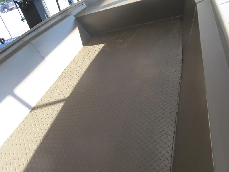 Slide: The Image of 2025 WeldBilt 1448V boat interior with diamond plate flooring. - 14