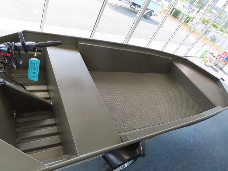 Slide: The Image of 2025 WeldBilt 1448V aluminum boat interior with bench seating and textured flooring. - 6