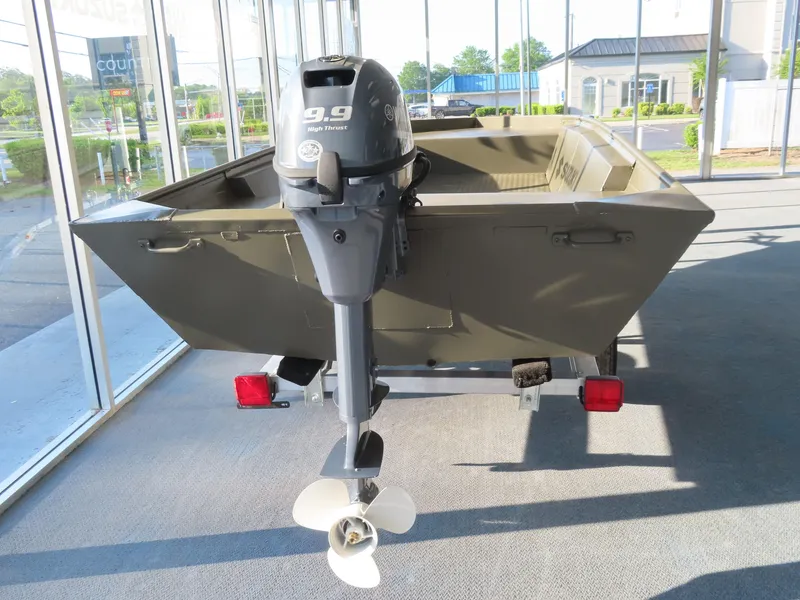 Slide: The Image of 2025 WeldBilt 1448V boat with outboard motor in showroom. - 7