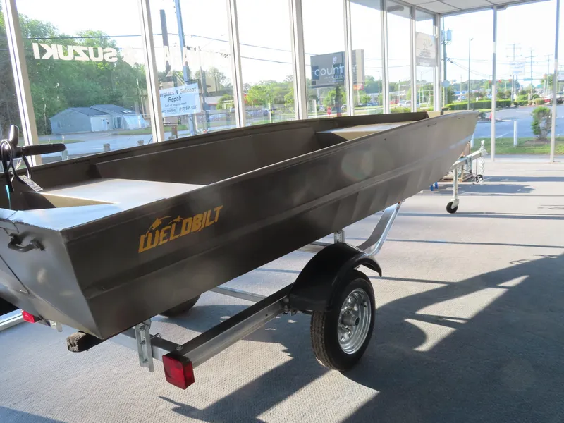 Slide: The Image of 2025 WeldBilt 1448V boat on trailer in showroom. - 8