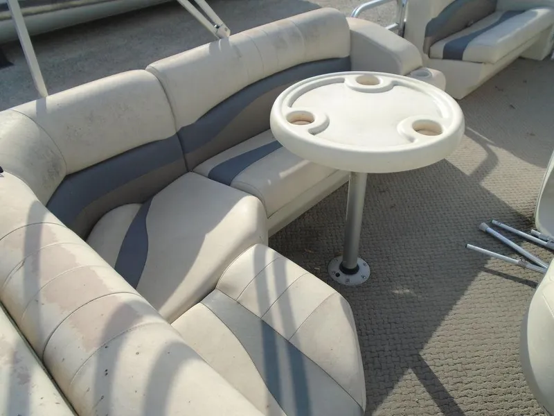 Slide: The Image of Lowe Trinidad 200 boat interior with seating and round table, 2005 model. - 11