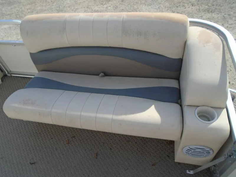 Slide: The Image of 2005 Lowe Trinidad 200 boat seat with cup holder and speaker. - 13