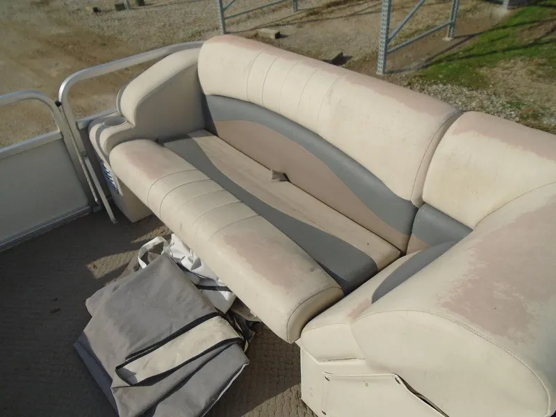 Slide: The Image of Worn beige and gray boat seating on a 2005 Lowe Trinidad 200. - 14
