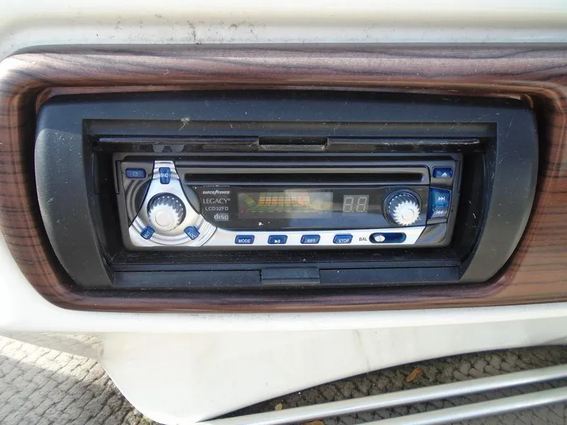 Slide: The Image of 2005 Lowe Trinidad 200 boat stereo system with wood trim. - 15