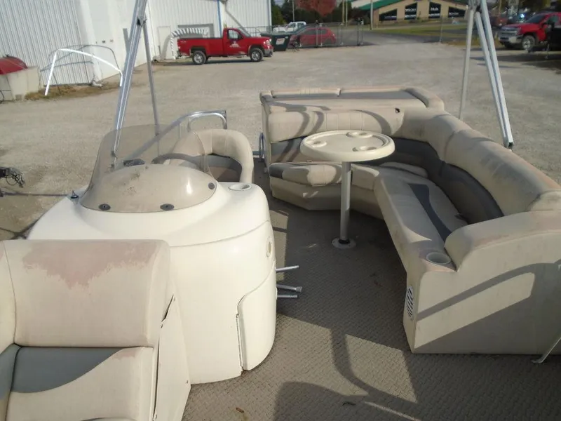 Slide: The Image of 2005 Lowe Trinidad 200 pontoon boat interior with seating and table. - 18
