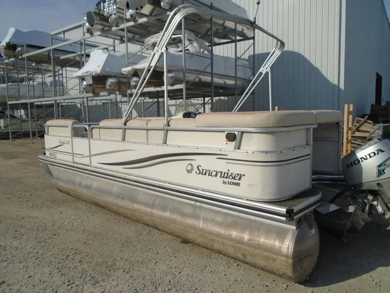 Slide: The Image of 2005 Lowe Trinidad 200 pontoon boat in storage yard. - 19