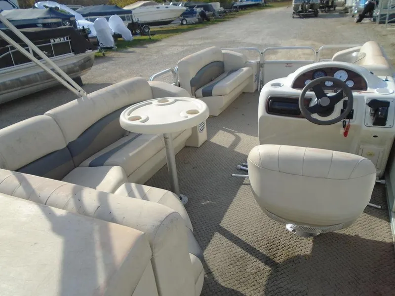 Slide: The Image of 2005 Lowe Trinidad 200 pontoon boat interior with seating and steering console. - 3