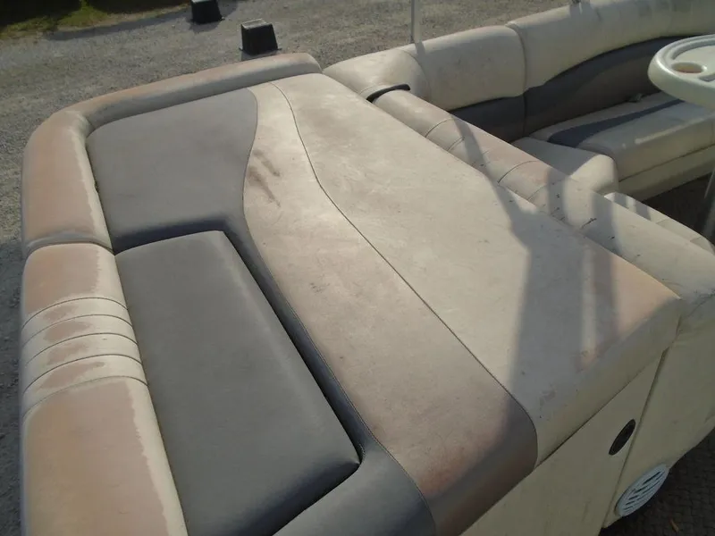 Slide: The Image of 2005 Lowe Trinidad 200 boat seating with beige and gray upholstery. - 5
