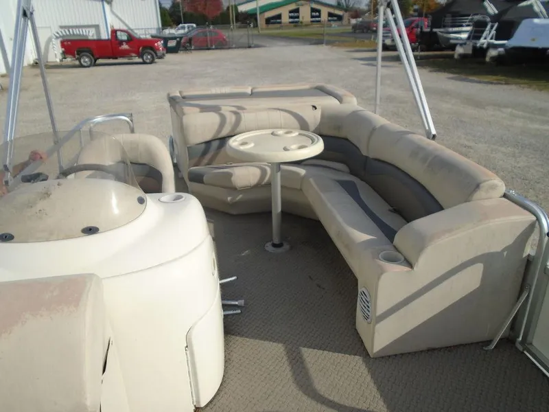 Slide: The Image of 2005 Lowe Trinidad 200 pontoon boat interior with seating and table. - 8