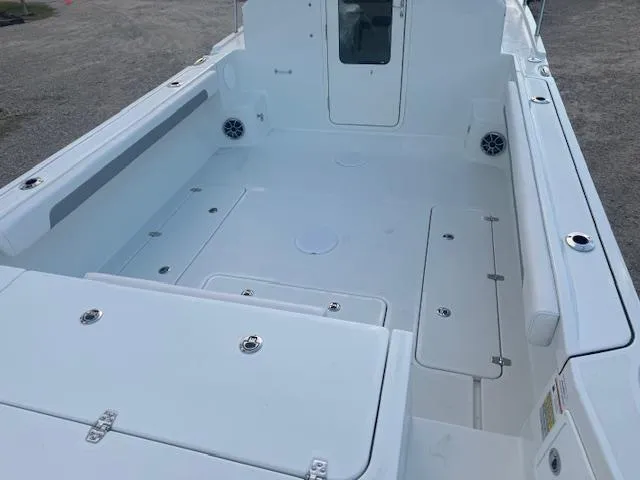 Slide: The Image of 2025 Parker 2420 Sport Cabin boat deck, spacious and clean design. - 11