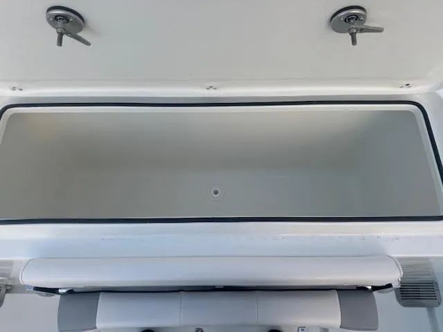 Slide: The Image of Open storage compartment in 2025 Parker 2420 Sport Cabin boat. - 9