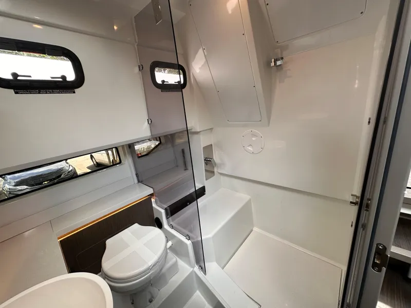 Slide: The Image of Modern bathroom in 2023 Wellcraft 355 boat with sleek sink and toilet. - 18