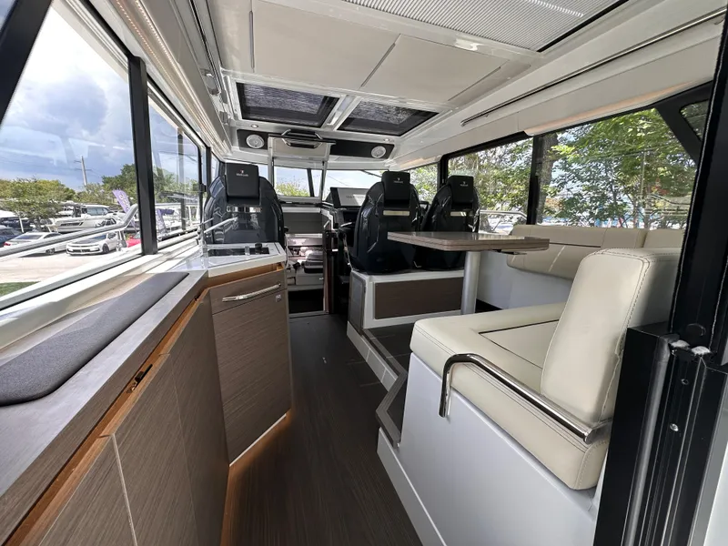Slide: The Image of Interior of 2023 Wellcraft 355 boat with modern kitchen and seating. - 8