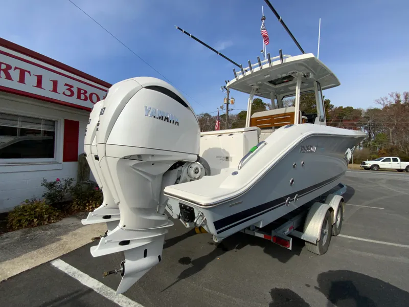 Slide: The Image of 2025 Pursuit S 288 Sport boat with Yamaha engines on a trailer. - 10