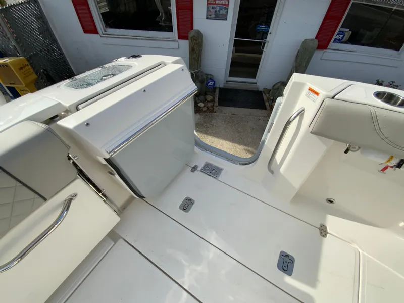 Slide: The Image of 2025 Pursuit S 288 Sport boat deck with seating and storage compartments. - 22