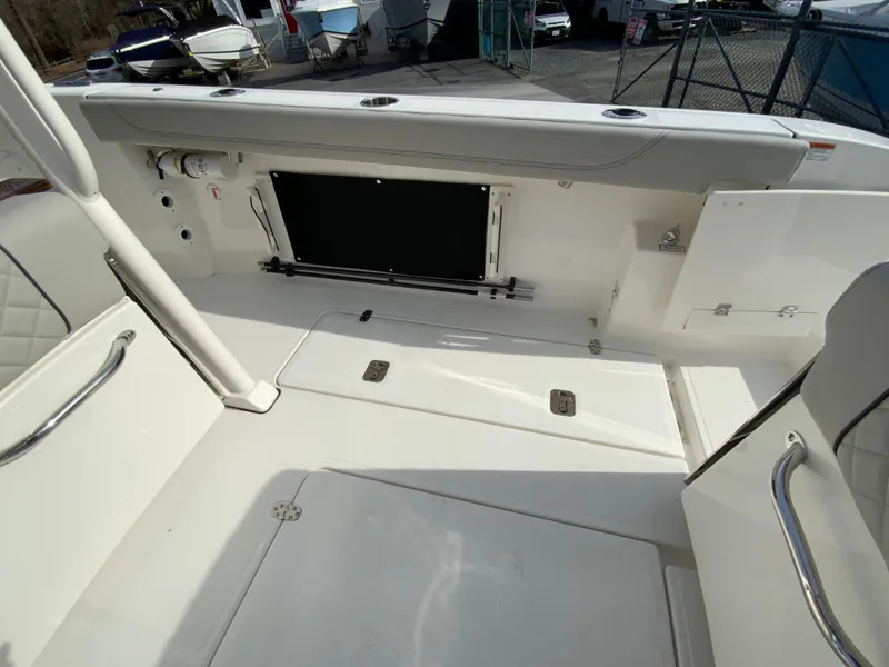 Slide: The Image of 2025 Pursuit S 288 Sport boat interior with storage compartments and seating. - 23