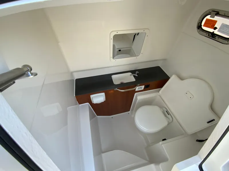 Slide: The Image of 2025 Pursuit S 288 Sport boat bathroom with sink and toilet. - 38