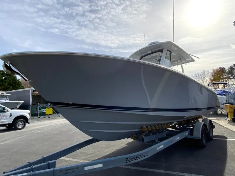 Slide: The Image of 2025 Pursuit S 288 Sport boat on trailer under sunny sky. - 5